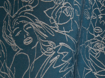 Regard tissu ameublement imprimé visages de Jean Paul Gaultier pour fauteuil, canapé, jetés de lit et rideau, vendu par la rime des matieres