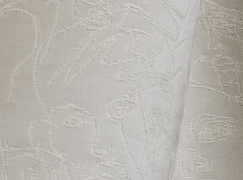 Regard tissu ameublement imprimé visages de Jean Paul Gaultier pour fauteuil, canapé, jetés de lit et rideau, vendu par la rime des matieres